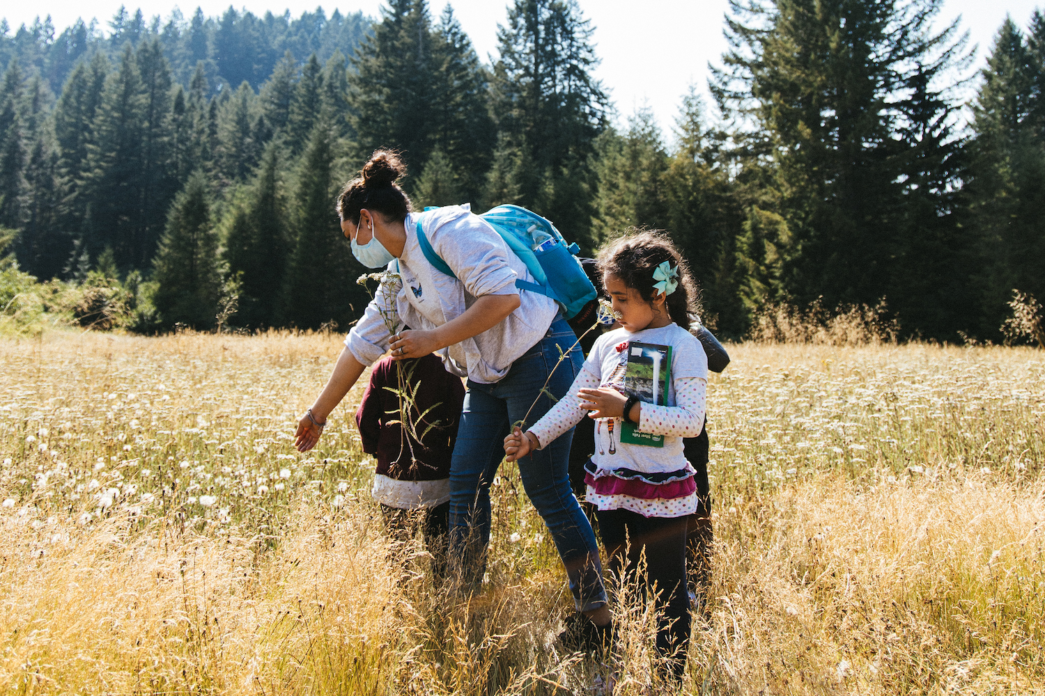 A family explores Silver Falls State Park during a summer learning workshop organized by Capaces Leadership Institute.