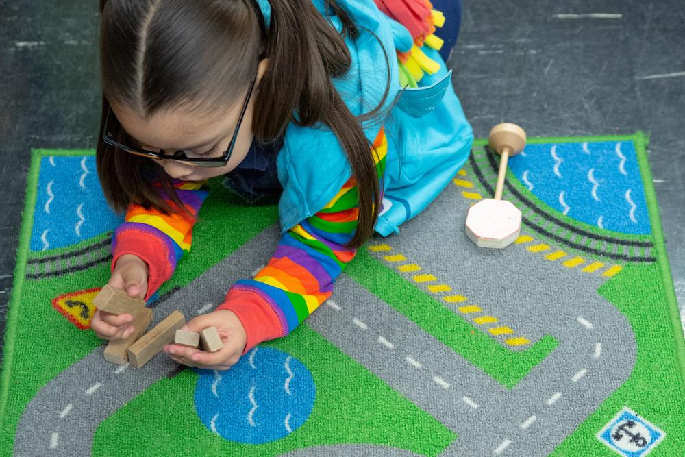 A child plays with blocks.