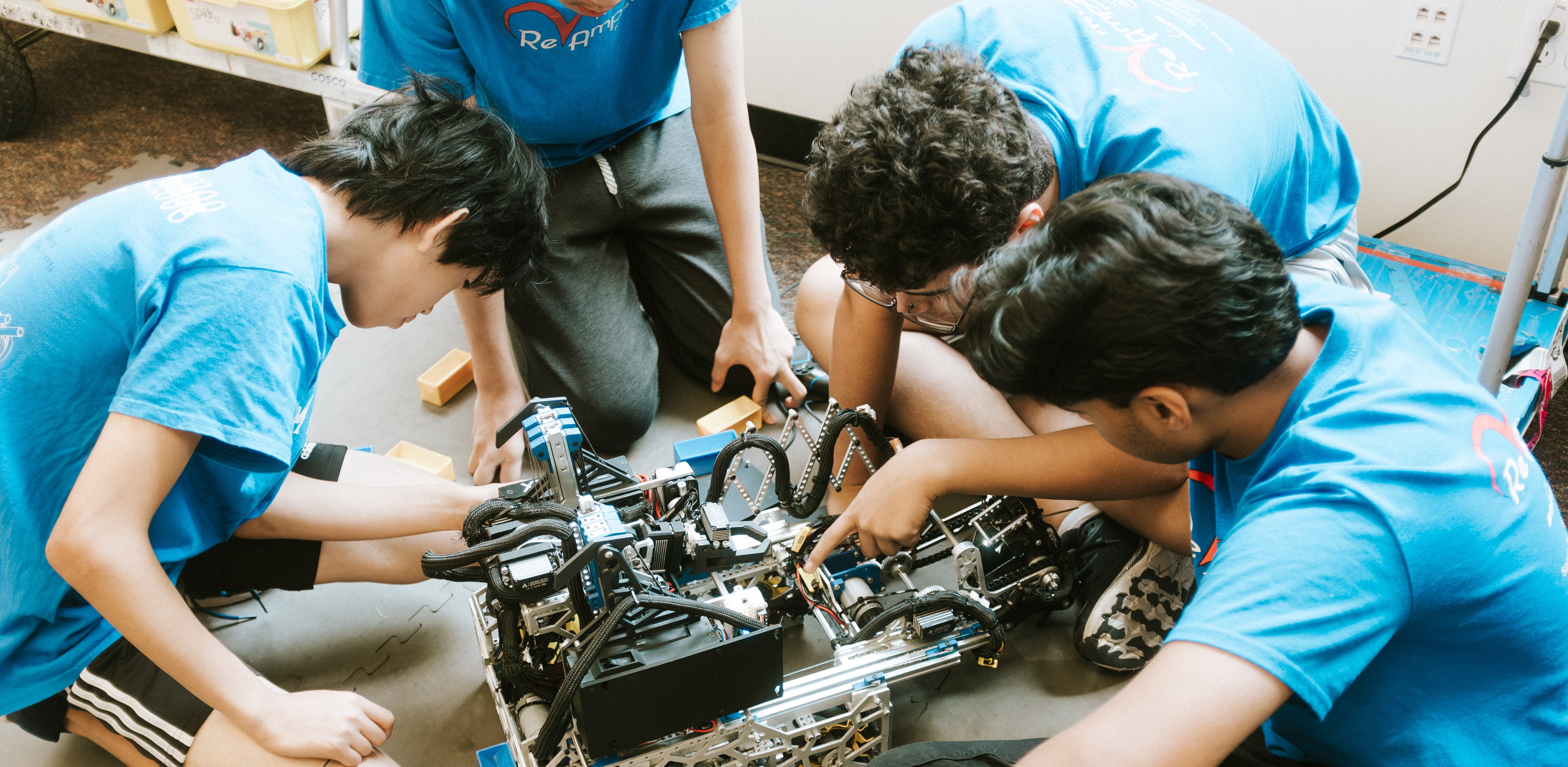 Youth learn about robotics at a summer learning program hosted by Project LEDO and REAP, Inc. in 2025. Photo by Jay Buezo.