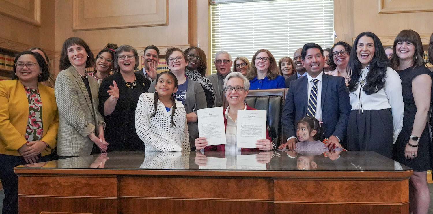 Gov. Tina Kotek ceremonially signs House Bills 2007 and 5047 at Oregon State Library.