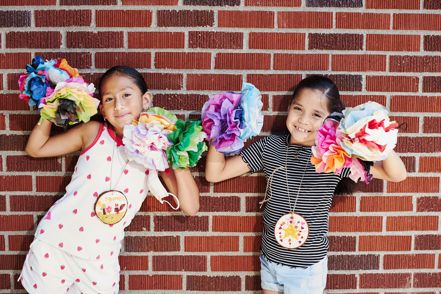 Youth share their hand-crafted 'flores de papel' at Adelante Mujeres' Chicas summer learning program in Cornelius.