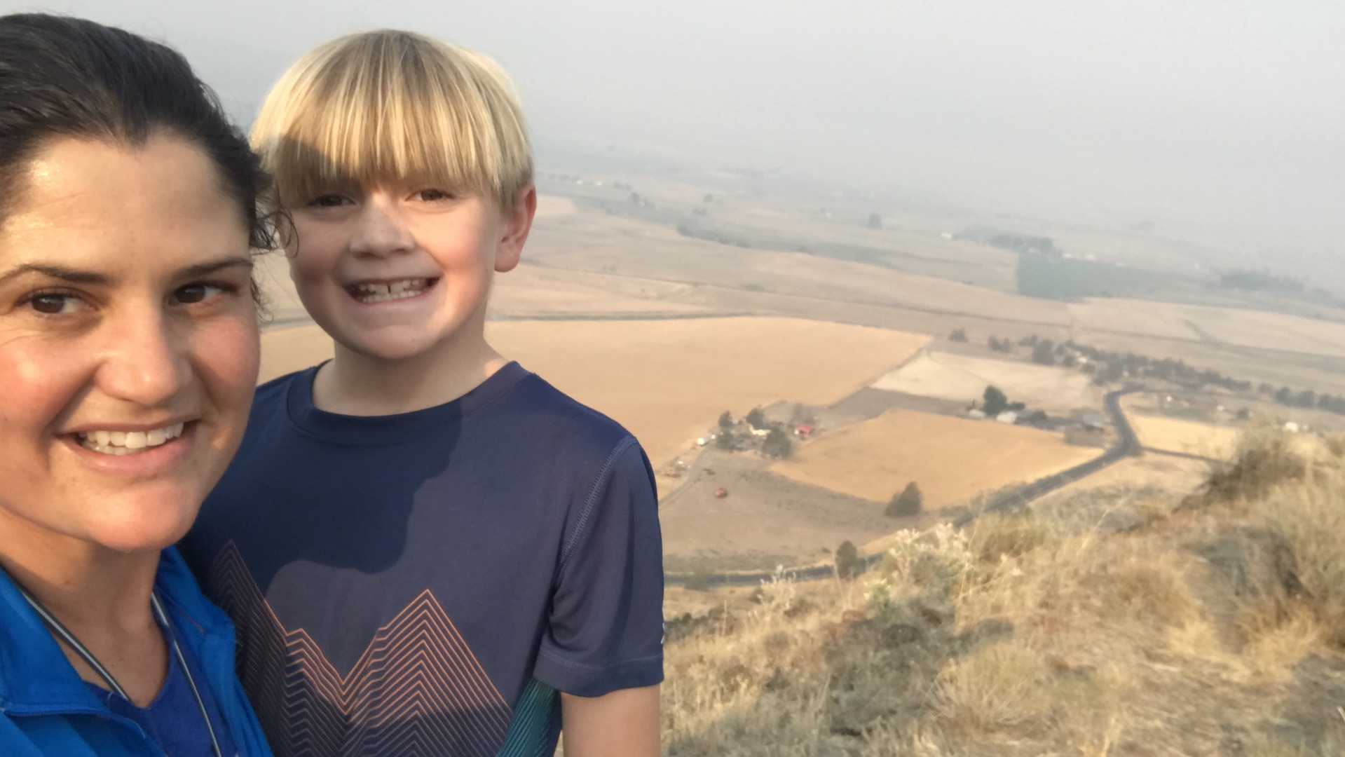 Jessie DuBose (left) and her son Wesley take in views of the southern Klamath Basin from the side of Stukel Mountain.