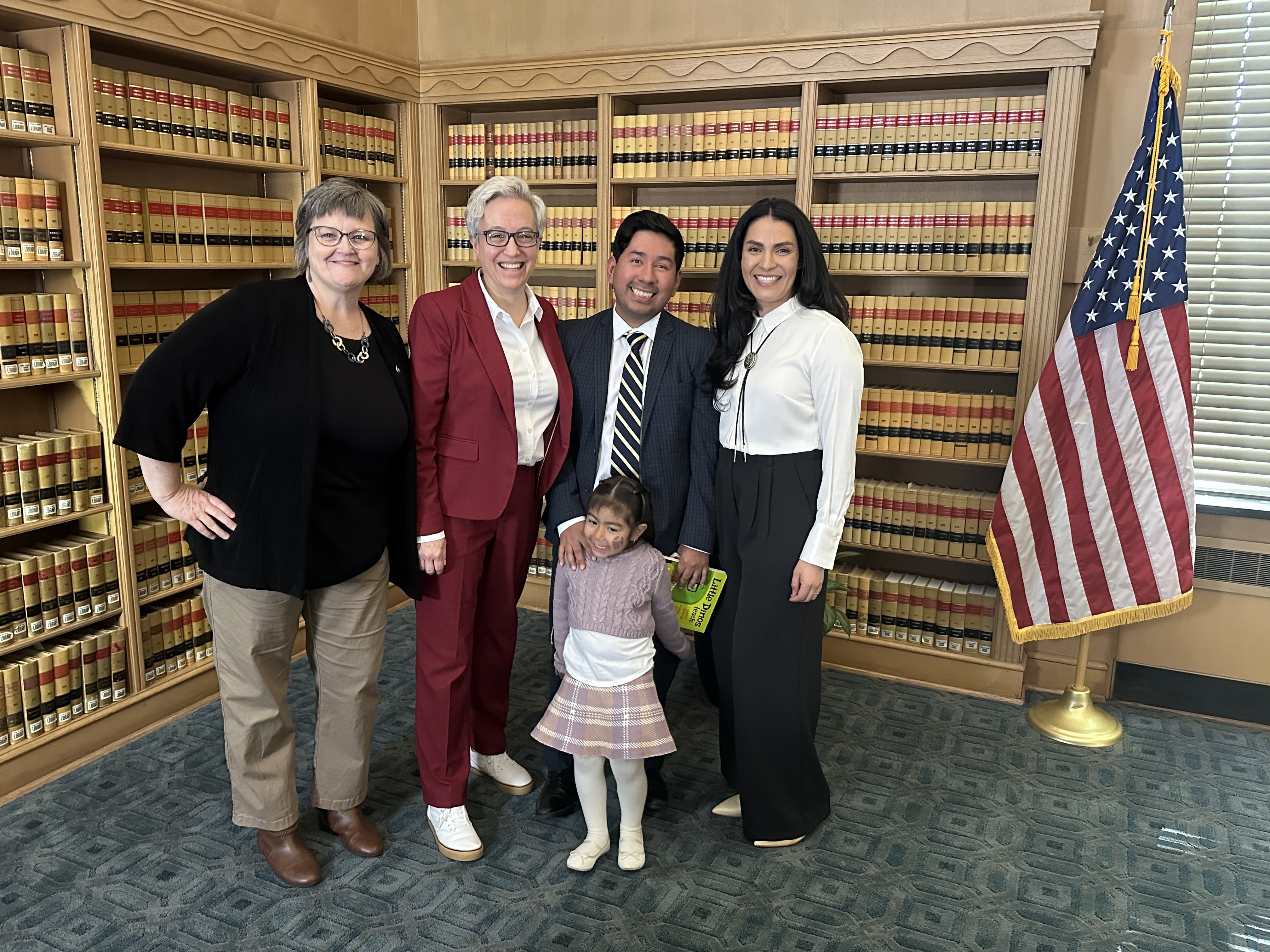 Sen. Janeen Sollman, Gov. Tina Kotek, Rep. Ricki Ruiz and his daughter, and FBO's Janet Soto Rodriguez at the ceremonial bill signing for summer learning.